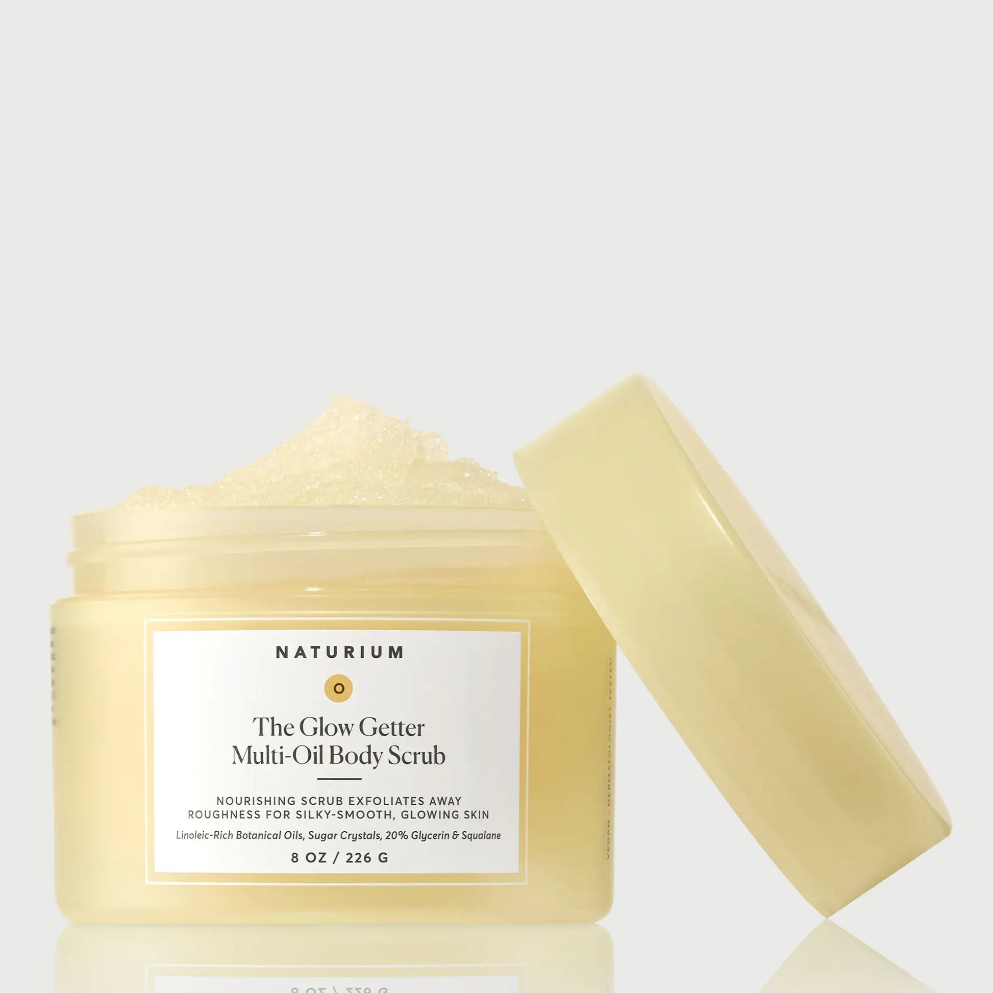 the-glow-getter-multi-oil-body-scrub-l4 NATR-40028-GlowGetter-Multi-Oil-Body-Scrub-Front-CapOff-bonebkgd.webp